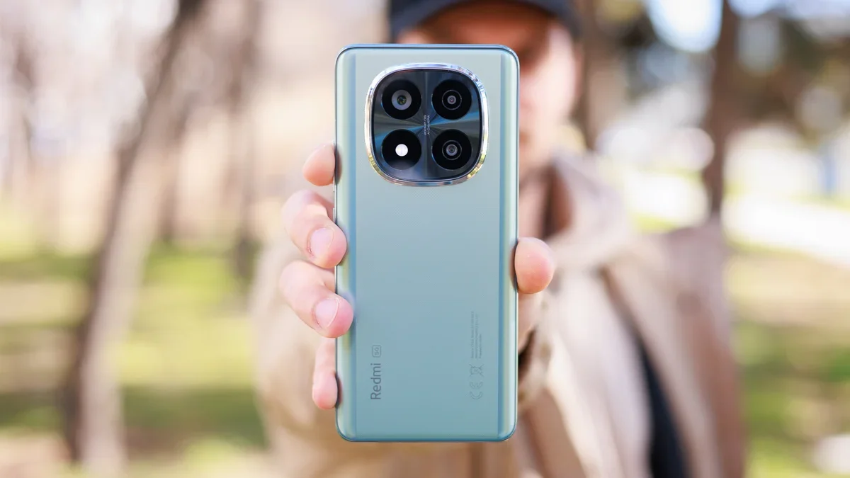 A person holding the Xiaomi Note 14 Pro+ 5G.