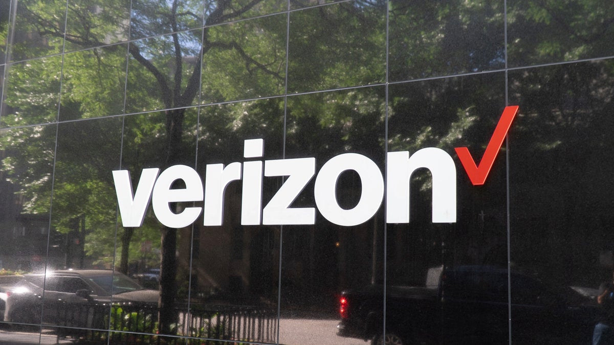 Verizon's logo displayed on a glass building.