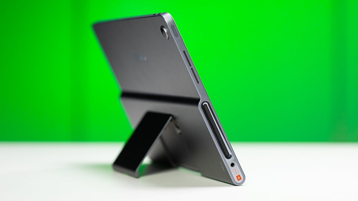 Side view of the Lenovo Tab Plus, showcasing its built-in kickstand and JBL speaker grille.