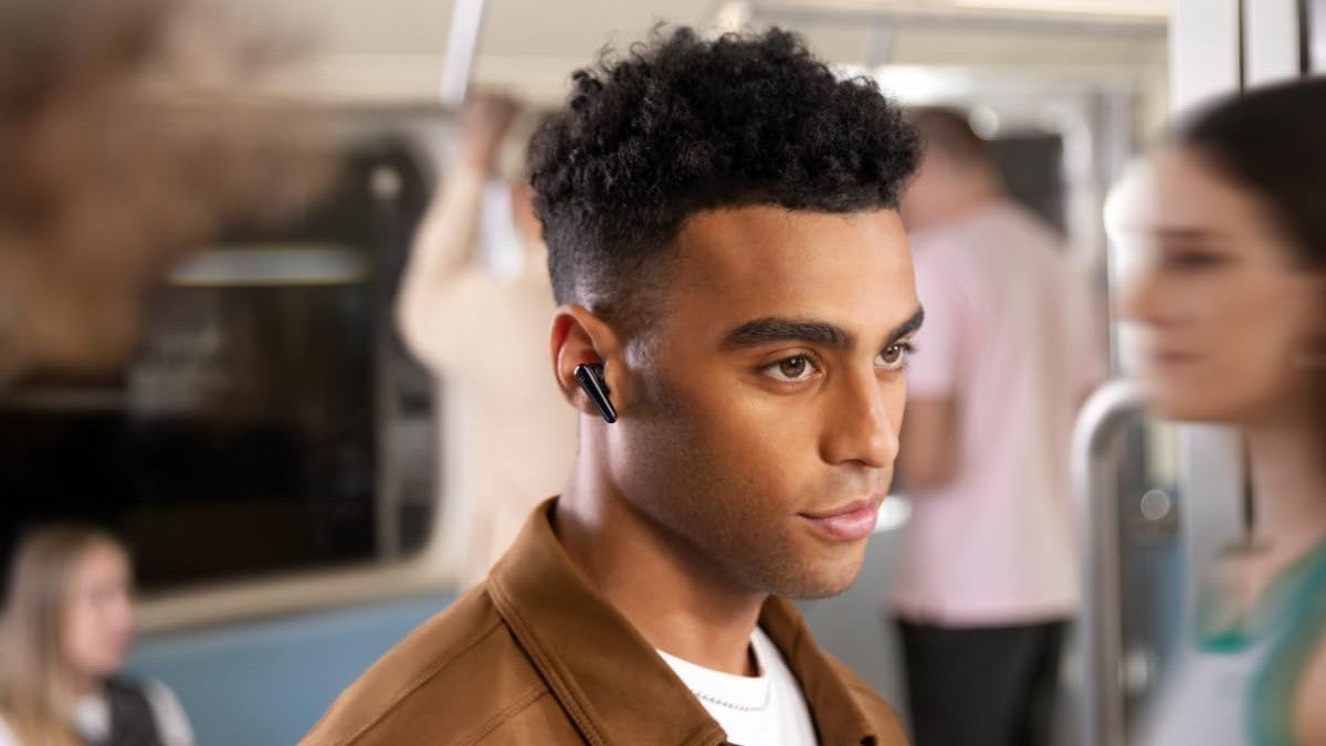 A close-up of a person wearing a pair of Soundcore Liberty 4 Pro.