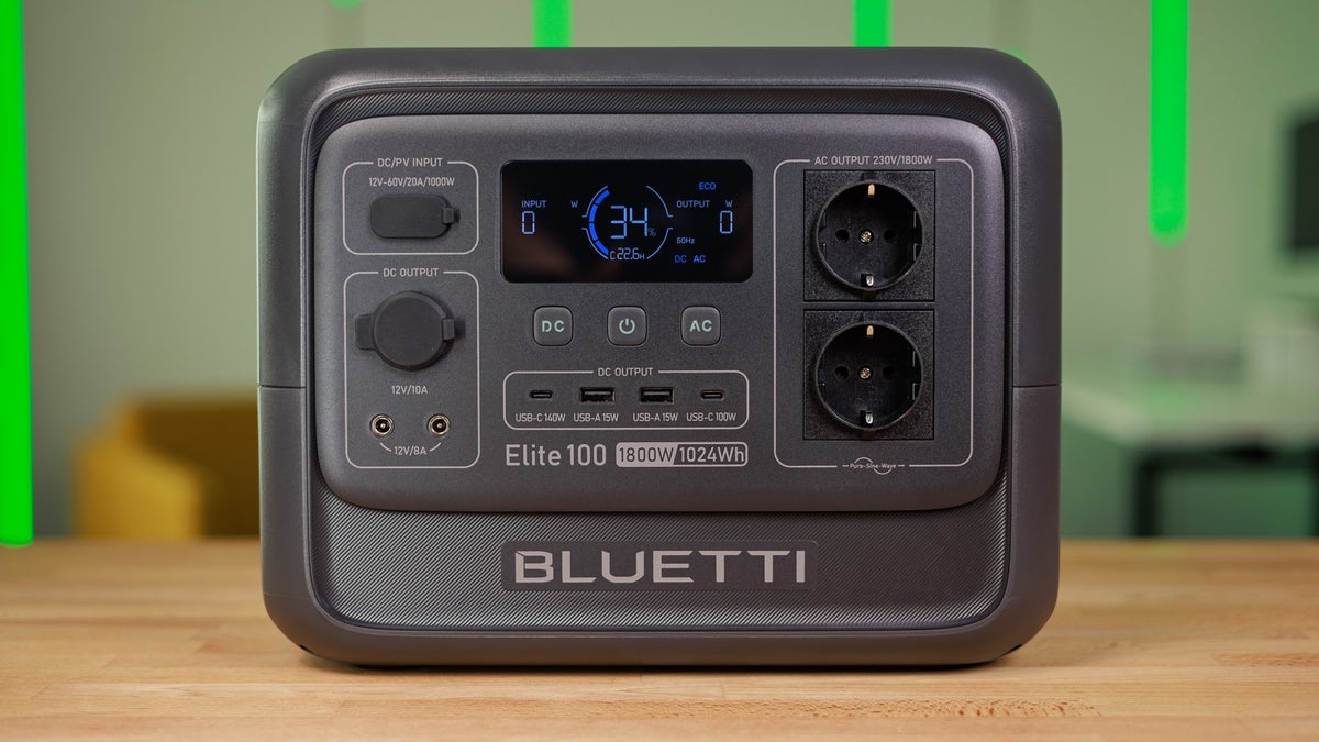 The Bluetti Elite 100 v2 is placed on a wooden table.
