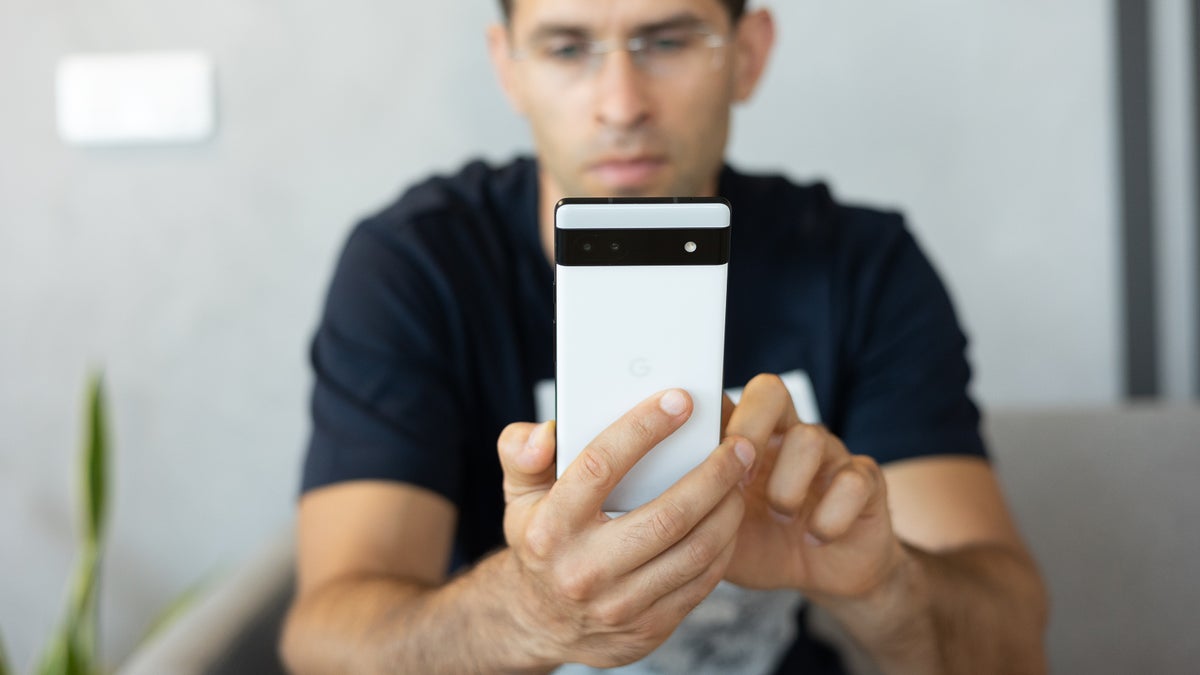Image of person holding the Google Pixel 6a
