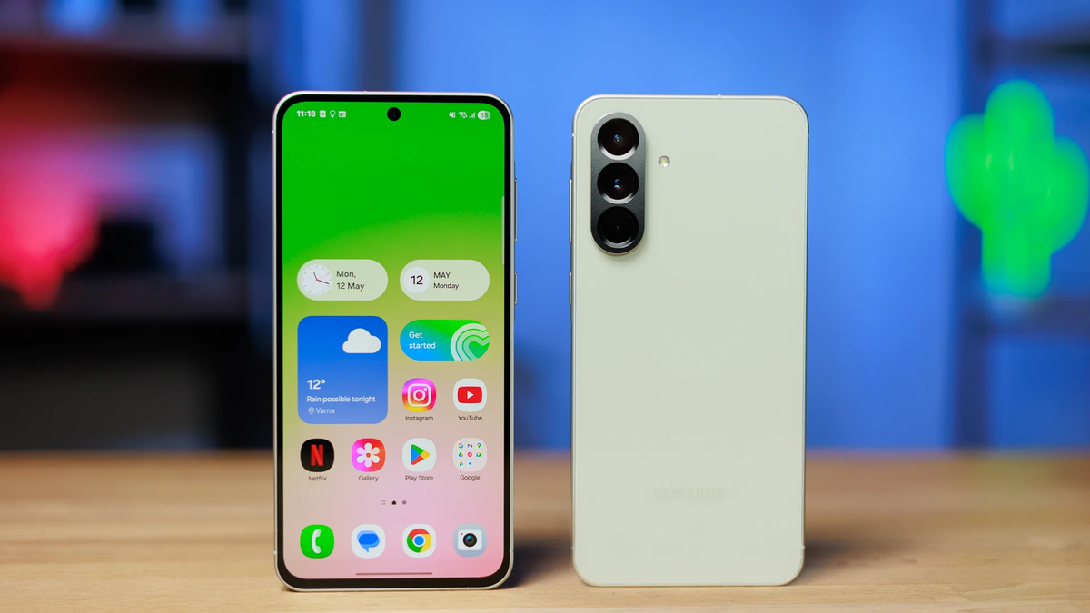 Front and back view of the Galaxy A56 on a wooden table.