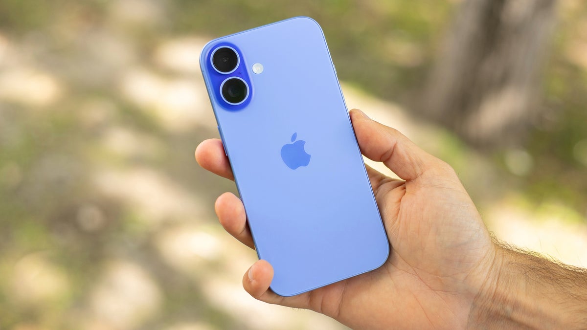 A photo of a person's hand holding the iPhone 16.
