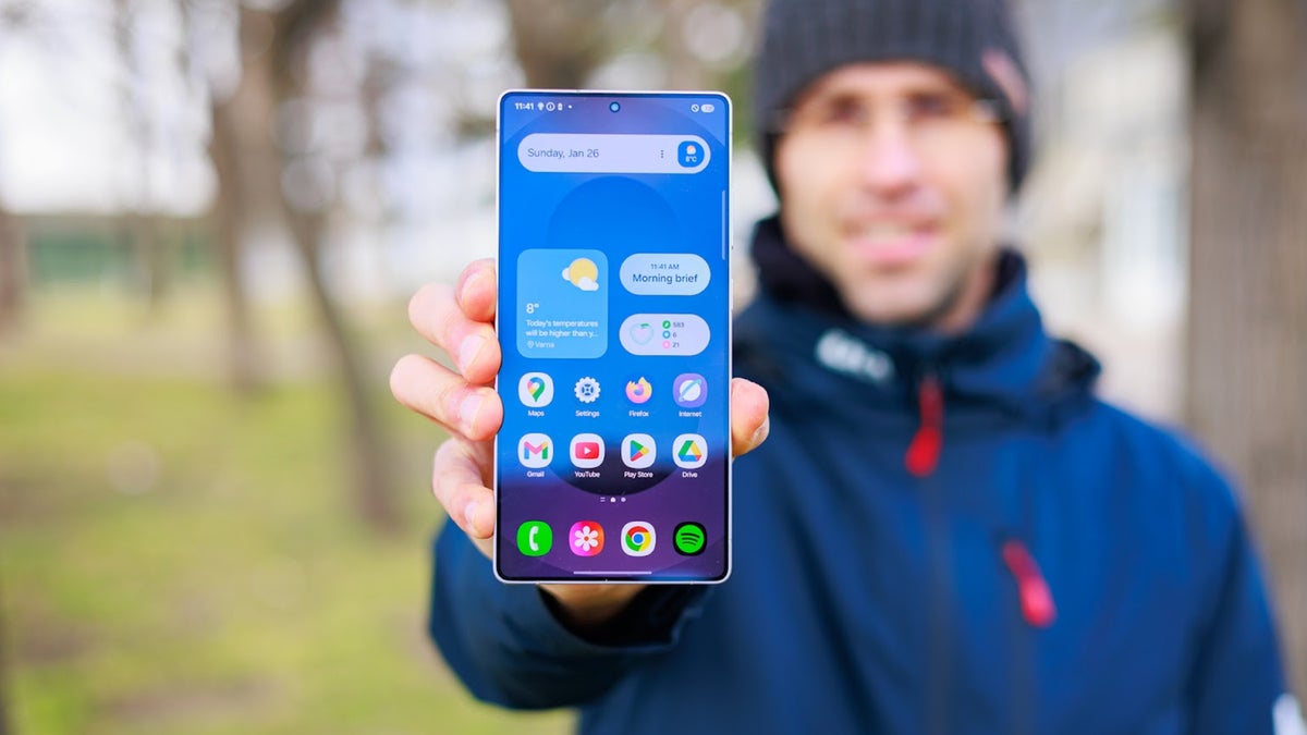 A man holding a Galaxy phone.