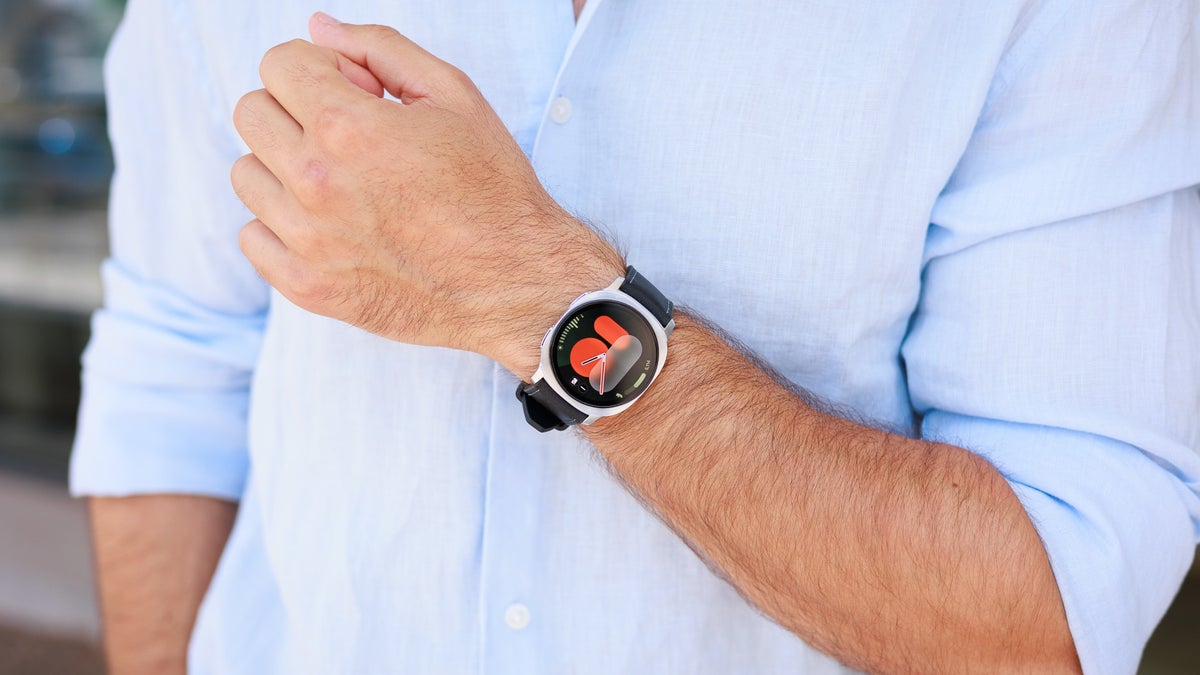 A person wearing a shirt is wearing the Galaxy Watch 8 on their wrist.