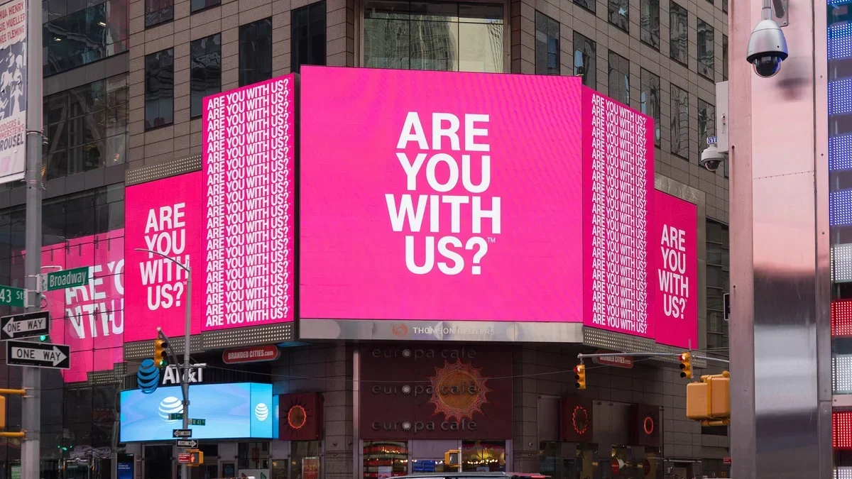 A digital billboard advertises T-Mobile on Broadway.