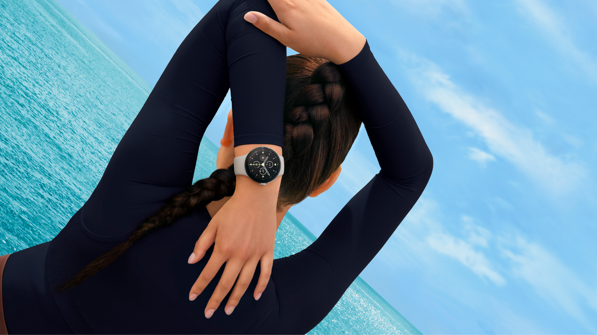 A photo of a woman wearing the Pixel Watch 4.