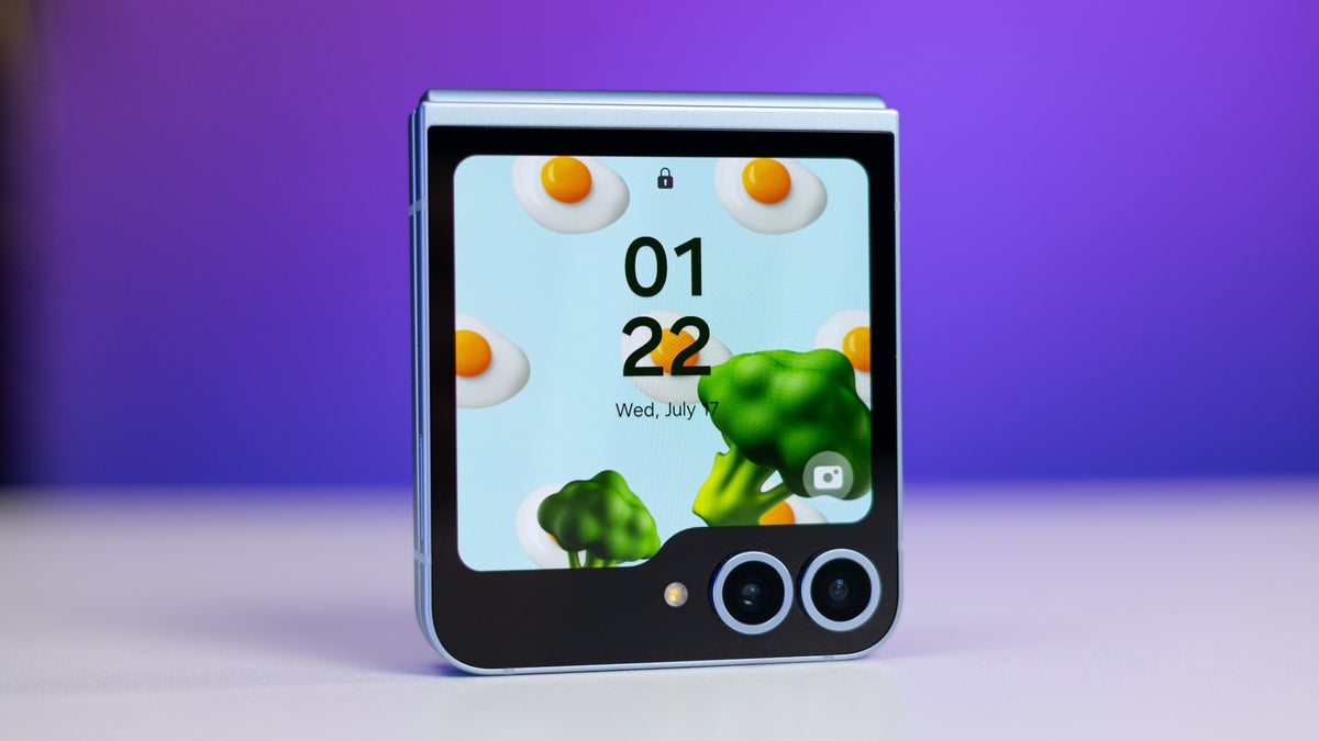 Galaxy Z Flip 6 folded on a table shows vibrant animations on its flex screen.
