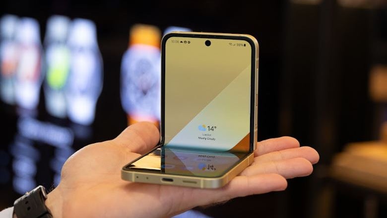 Holding a partially unfolded Galaxy Z Flip 6 in the palm of a hand