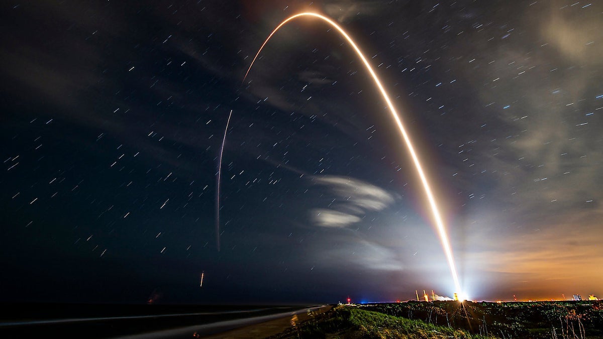 Light traces the lift off of a rocket designed to send another SpaceX satellite into space.