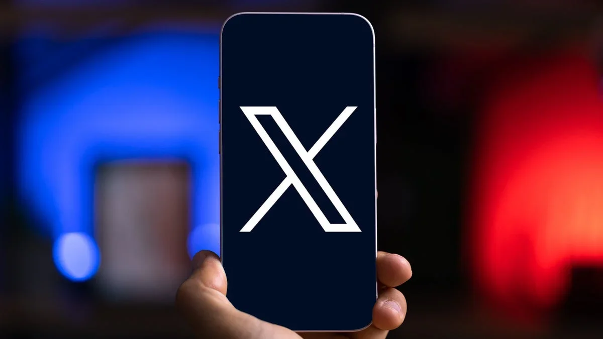 X logo on a phone.