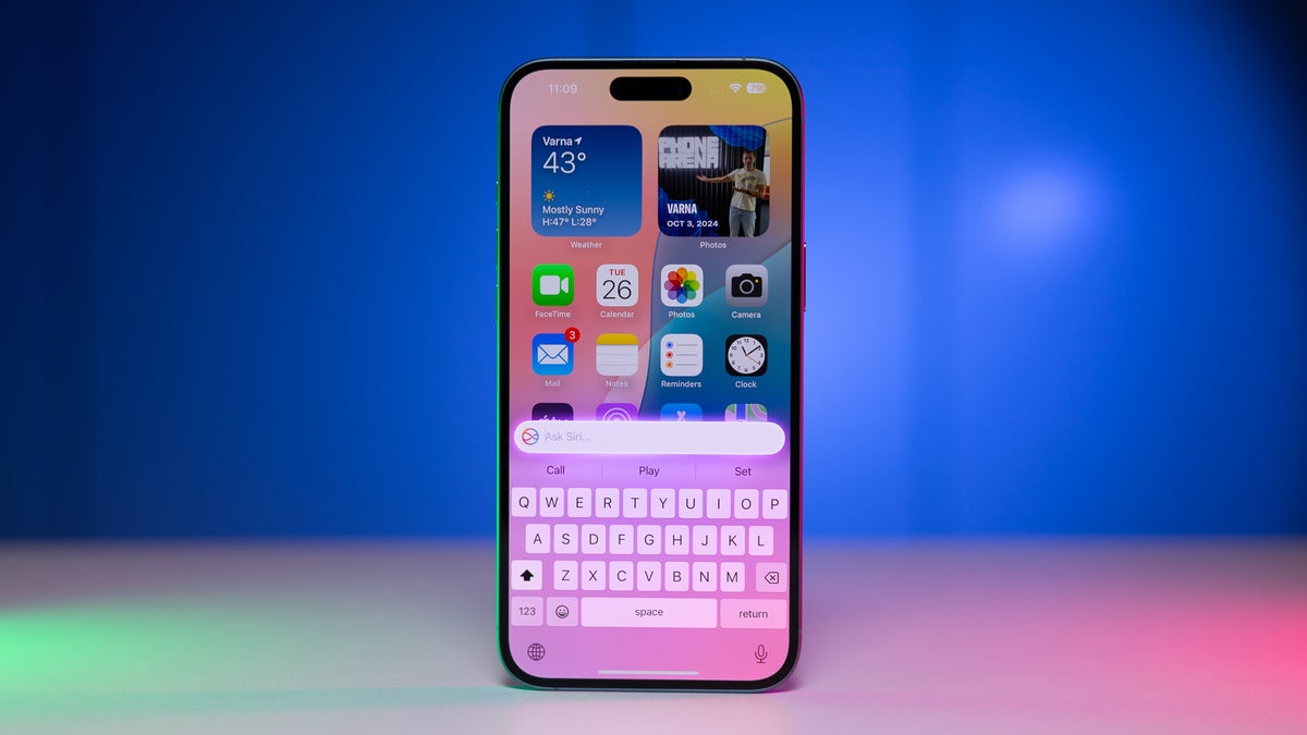 An iPhone with Siri opened.