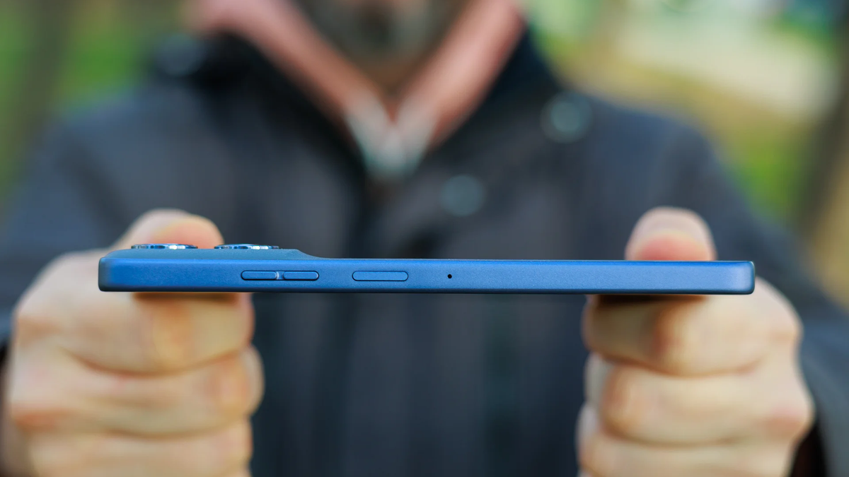 A person holds the Moto G Power (2025), showing its relatively slim profile.
