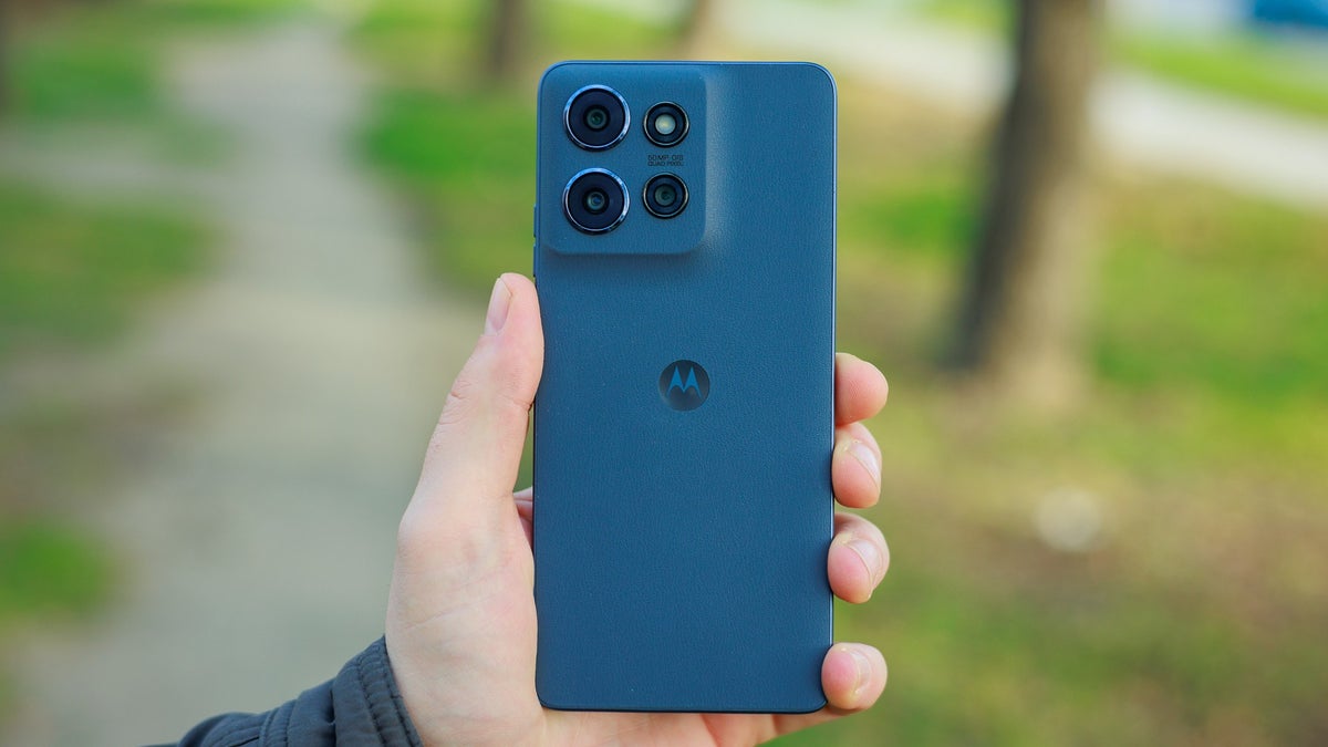 A person holds the Moto G Power (2025) in one hand, showing its rear design.