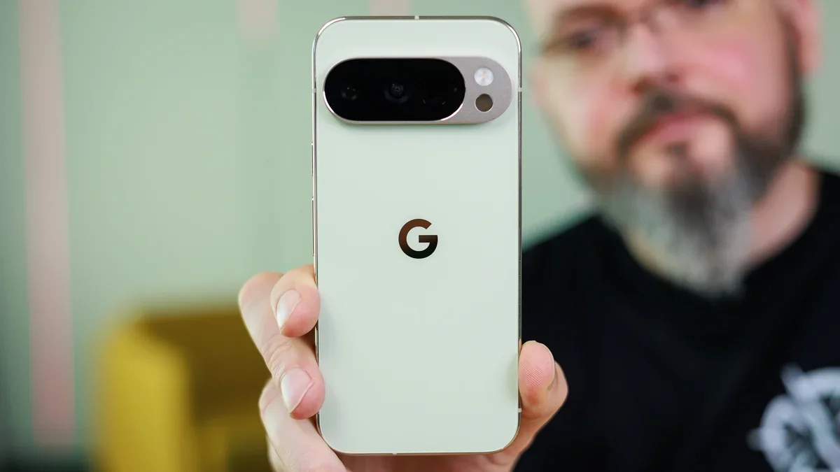 A close-up of a person holding a Pixel 10 Pro.