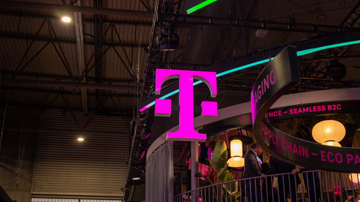 Iconic Magenta T-Mobile "T" logo floats at an industry conference.