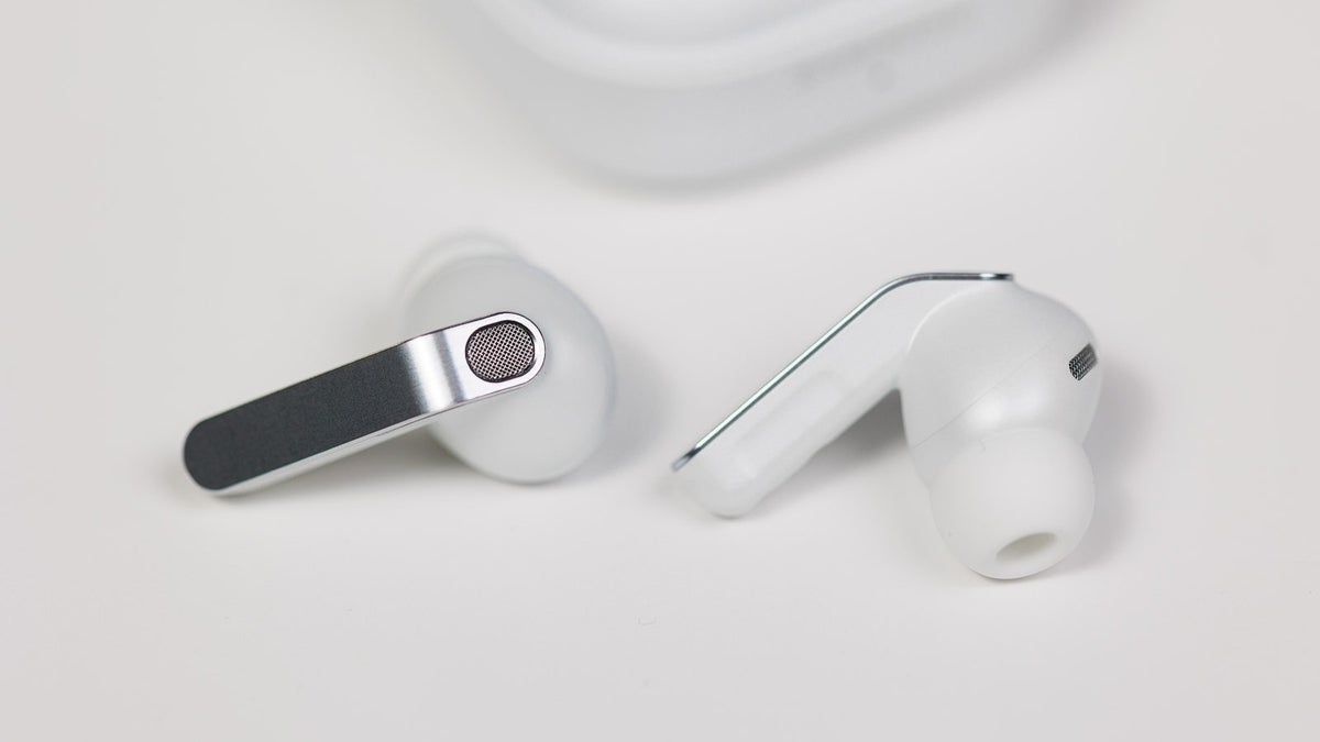 Galaxy Buds 4 Pro in white placed on a white table.