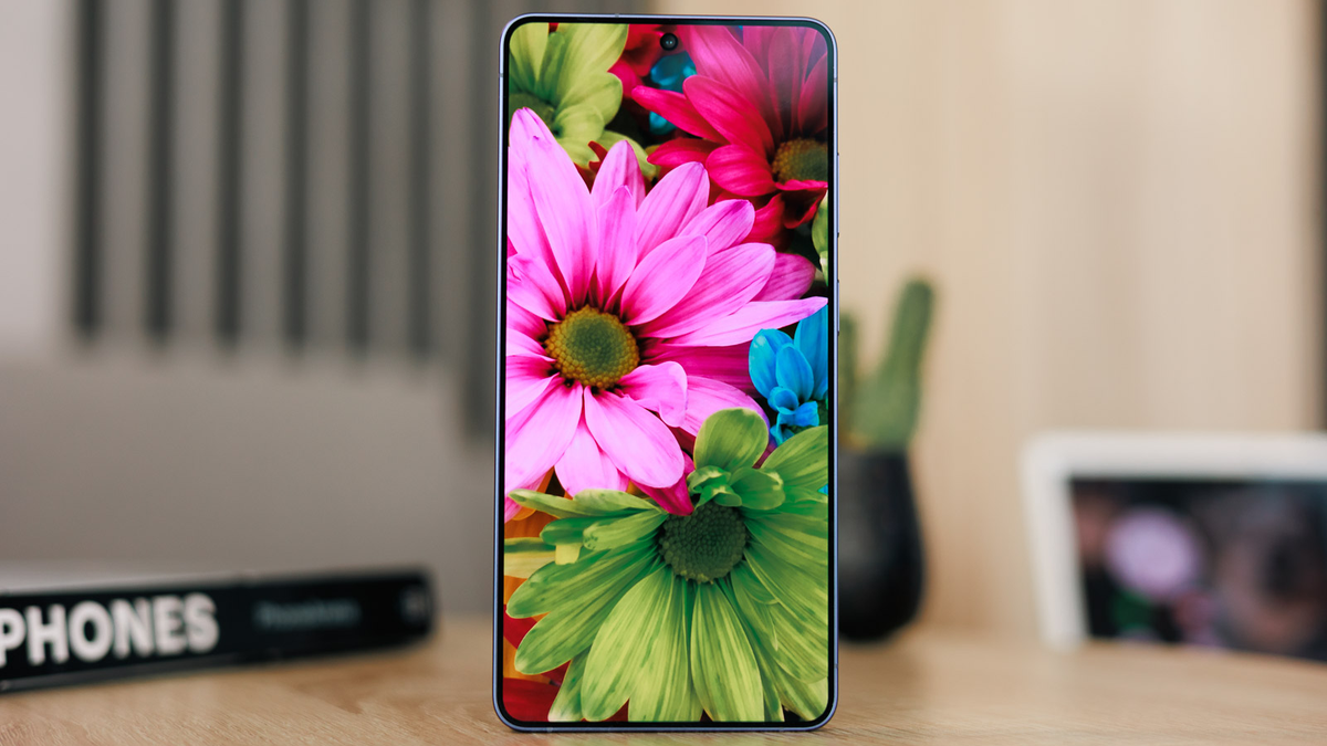 Galaxy S26 Ultra on a table, showing beautiful flowers on its bright display.
