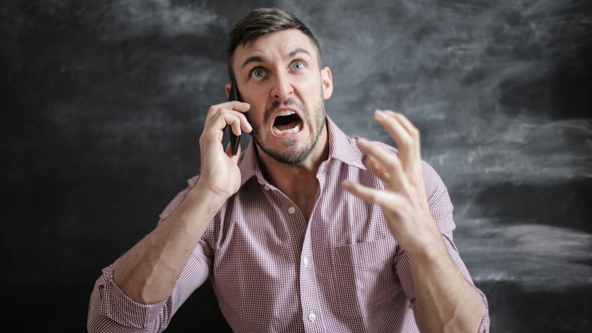 An angry man with a phone.
