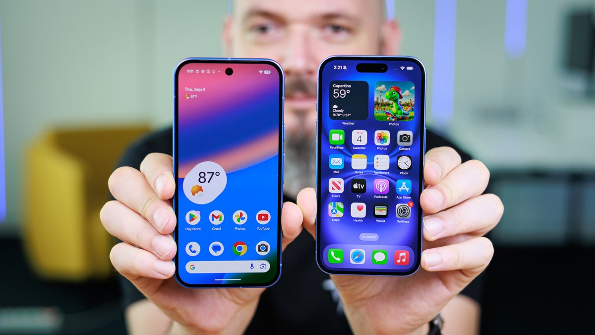 A man is holding an iPhone 16 in one hand and a Pixel 10 in the other.