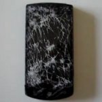 LG Optimus 7 lives through being run over by a car, but it isn't pretty