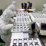 Alleged snapshot of the next iPhone's display production line features a revamped home key