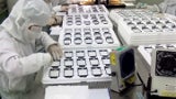 Alleged snapshot of the next iPhone's display production line features a revamped home key