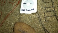 "Stay hungry, stay foolish": an improvised memorial builds in front of Steve Jobs house