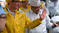 Tim Cook shakes hands with the Chinese VP en route to the Foxconn facilities
