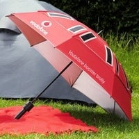 Umbrella boosts cell phone signal, charges batteries, protects from rain