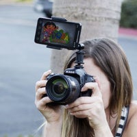 Look Lock will hold your smartphone to a dSLRs so you can use them both at the same time