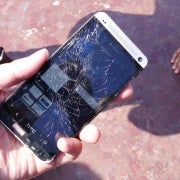 HTC One vs iPhone 5 drop test results in broken glass, shattered dreams