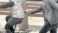 The art of stealing iPhones: Chinese man pickpockets a woman on a bike using... chopsticks!