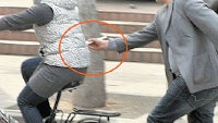 The art of stealing iPhones: Chinese man pickpockets a woman on a bike using... chopsticks!