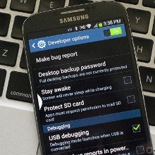 How to unlock developer settings on the Galaxy S4: tap seven times on the build number