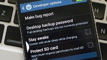 How to unlock developer settings on the Galaxy S4: tap seven times on the build number