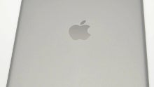 New space gray Apple iPad 5 tablet pictured from all angles, stacked with the silver one