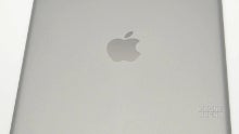 New space gray Apple iPad 5 tablet pictured from all angles, stacked with the silver one
