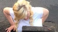 Girl gets stuck in a storm drain trying to rescue fallen BlackBerry