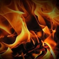 Woman dies while attempting to save her phone from her burning house