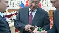 Vladimir Putin presents the People's President with the pinnacle of Russian tech, YotaPhone 2