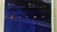Samsung Galaxy Note 5 appears in gold; your index finger will be used to pry out the S Pen