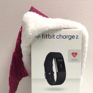 giving away 12 Fitbit Charge 