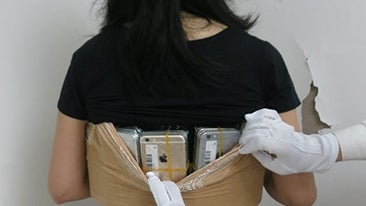 Smuggler caught with 102 iPhones strapped to her body