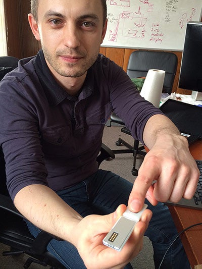 Paul Eremenko, a project leader, demonstrates a prototype pulse meter module. - Project Ara's working prototype to be finished next month