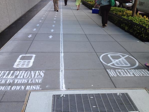 Sidewalk in Washington D.C. is marked up for a television show - No Cellphone walking lane created on Washington D.C. sidewalk as a social experiment for television