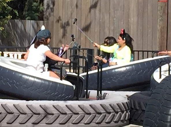 Selfie sticks used at Disneyland on Luigi's Flying Tires ride - Disney bans selfie sticks from rides and attractions at its parks