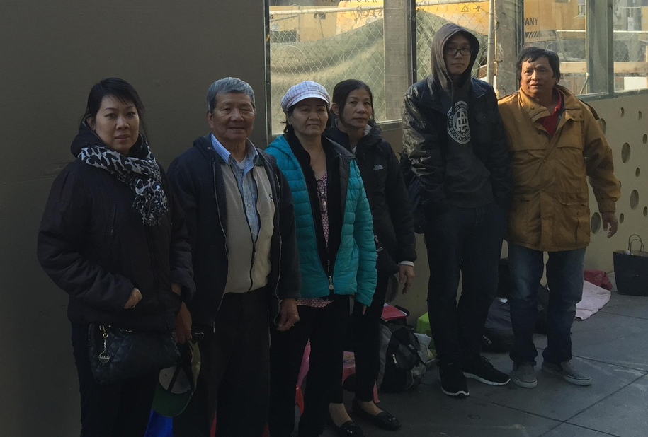 Six Vietnamese neighbors who live in San Francisco, wait outside the local Apple Store for Friday&#039;s iPhone launch - Lines forming by Apple Stores for Friday&#039;s launch of the Apple iPhone 6s and Apple iPhone 6s Plus