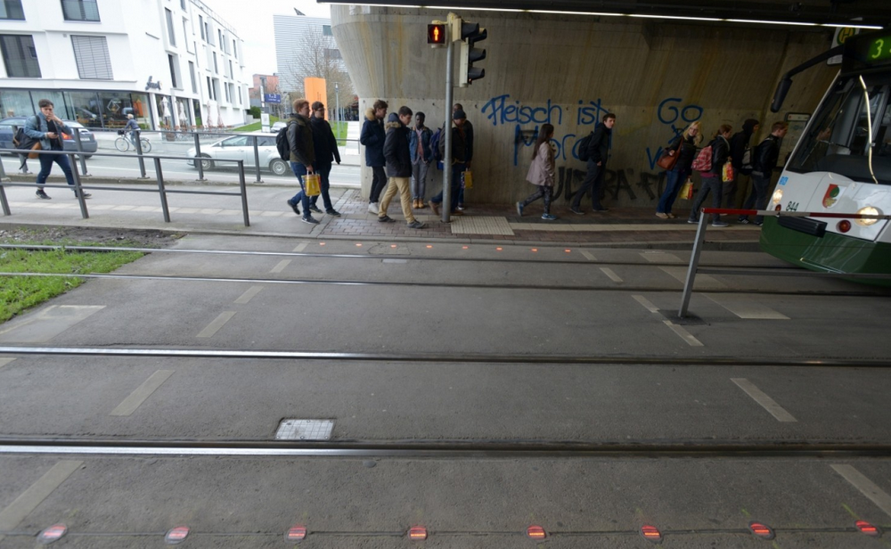 In the German city of Augsburg, traffic lights are embedded into the sidewalk for those who text and walk - German city caters to those who text and walk by placing traffic lights in a unique location